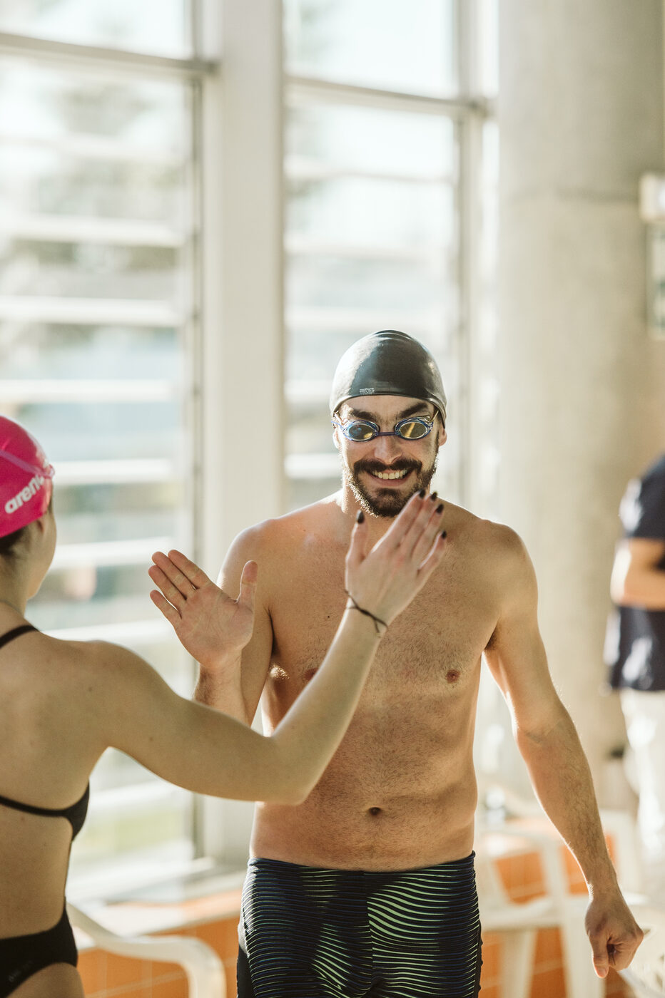 Athlete high-fiving at the EA Team / ANEA Swimming Tournament in Lisbon