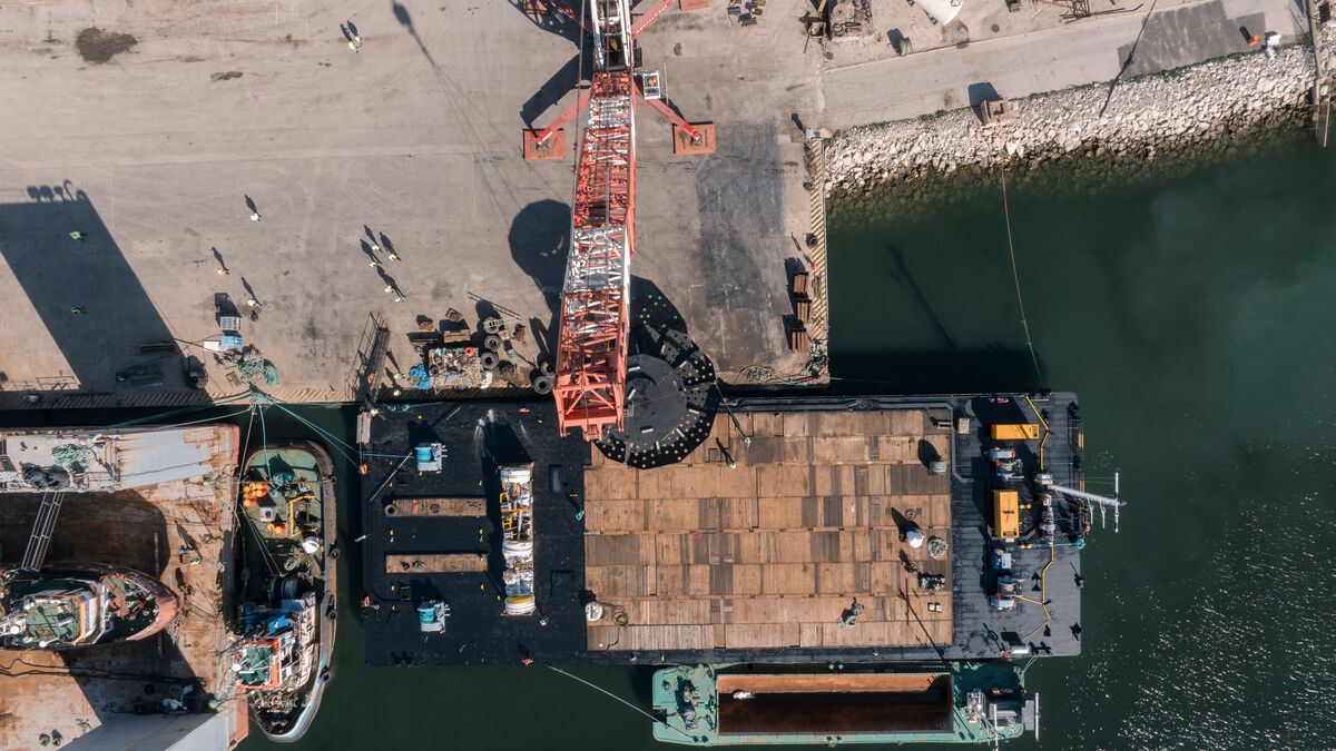 Aerial drone view of a loading operation with floating crane and Etermar steel structure