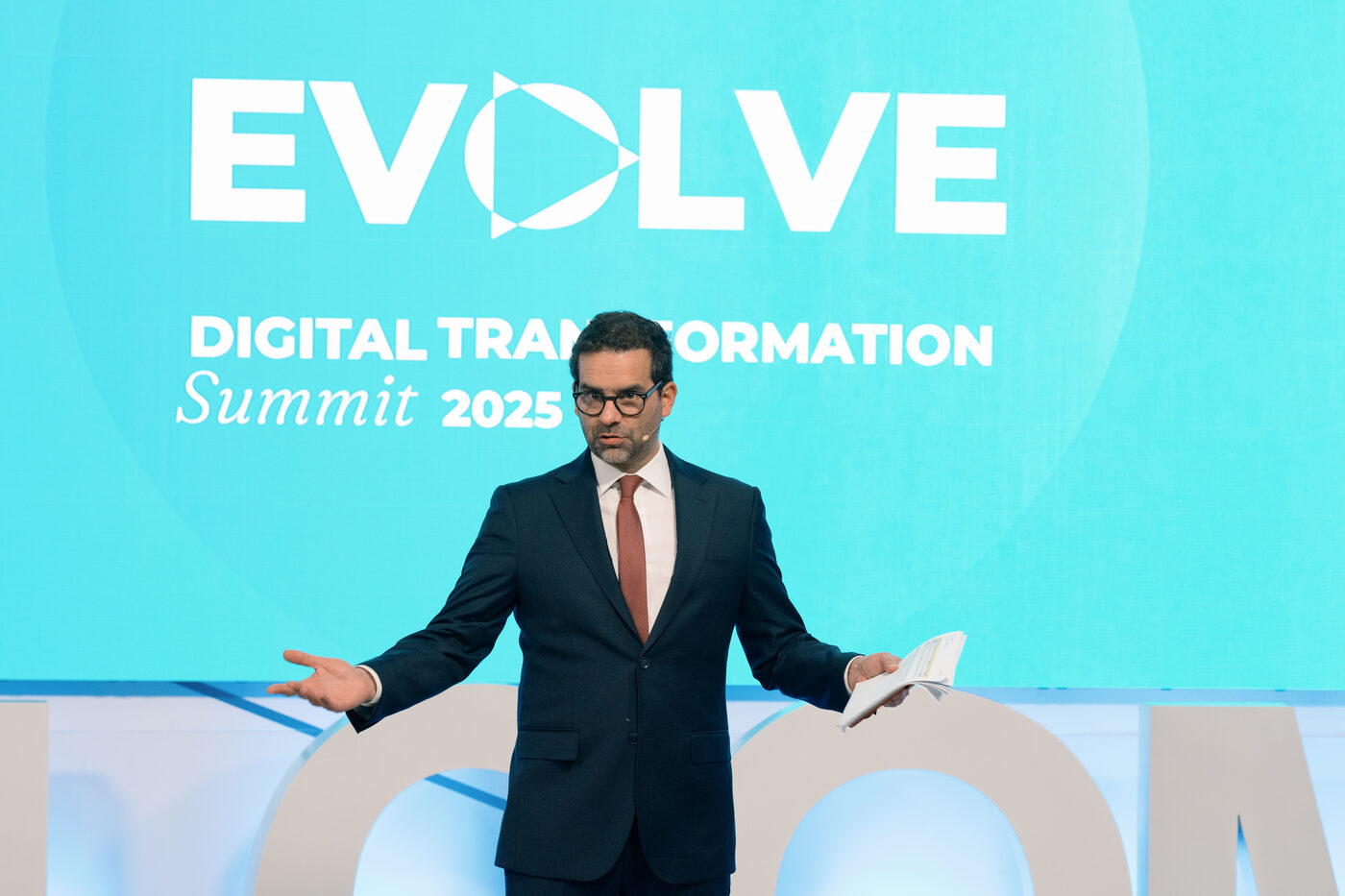 Speaker on stage during the EVOLVE Summit at Porto Business School