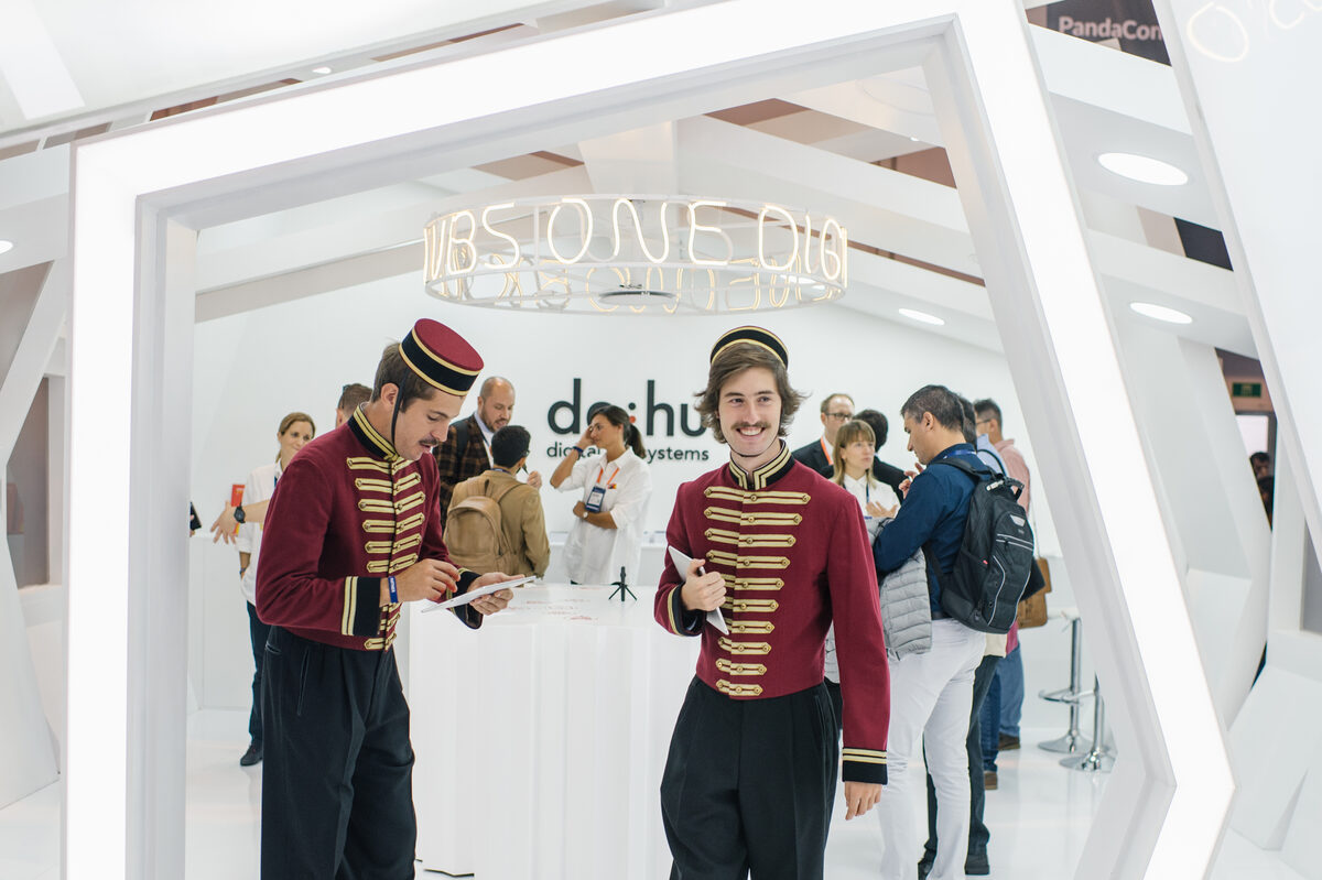 Brand stand with staff at Web Summit in Lisbon, corporate photography