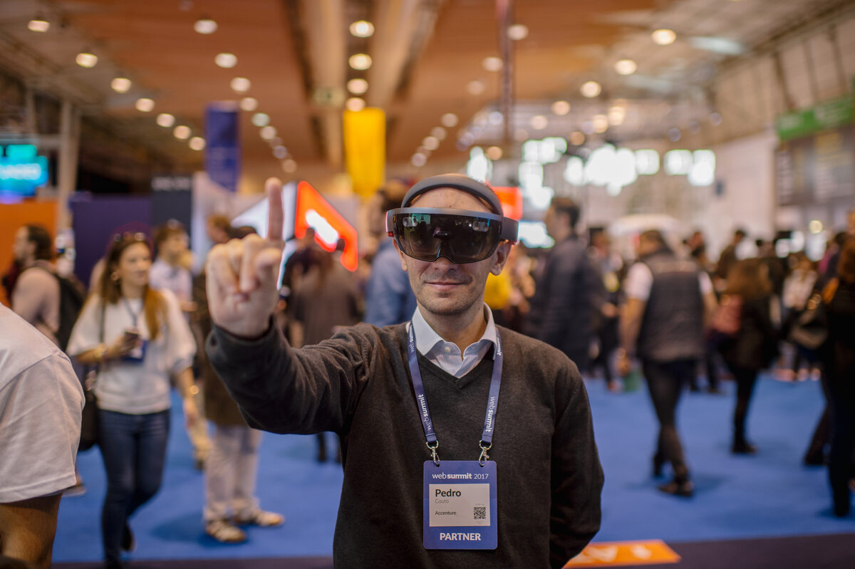 Visitor trying augmented reality at a Web Summit stand in Lisbon